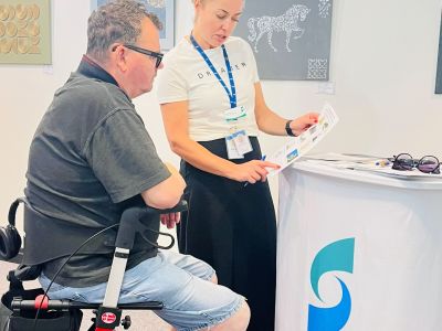 Community member visiting a pop-up information stall