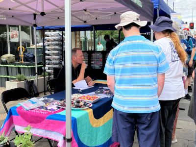 Community members visiting a pop-up information stall